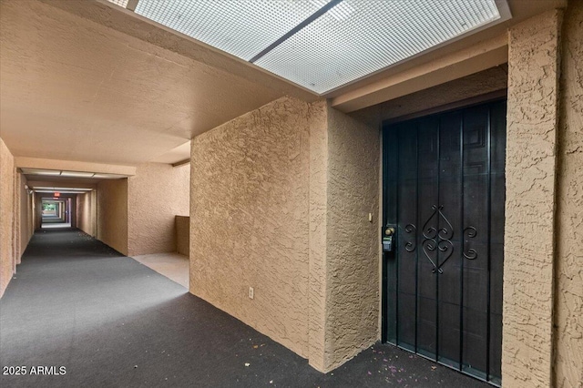 view of exterior entry featuring stucco siding
