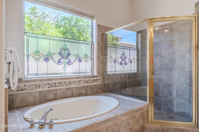 bathroom with separate shower and tub