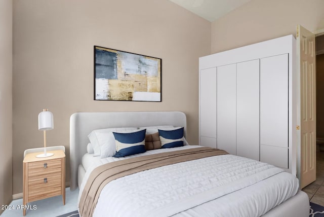 bedroom featuring a closet and vaulted ceiling