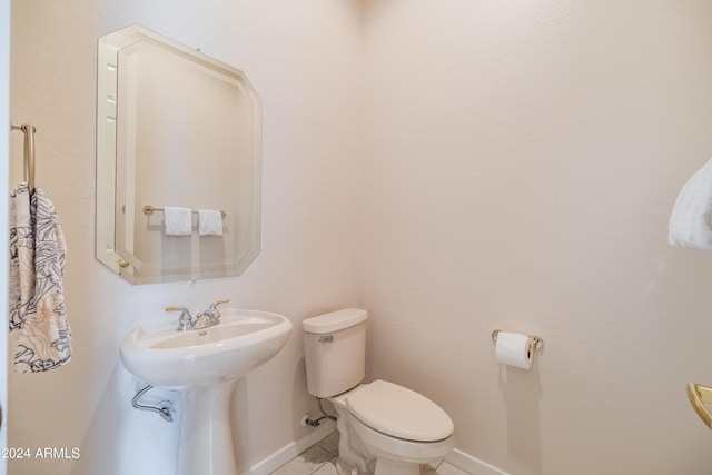 bathroom featuring toilet and tile patterned floors