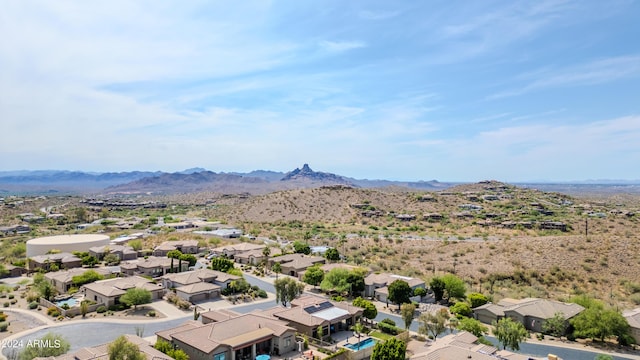 birds eye view of property featuring a mountain view