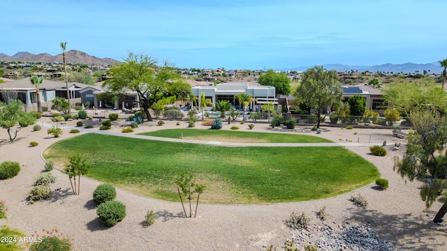 surrounding community featuring a mountain view and a yard