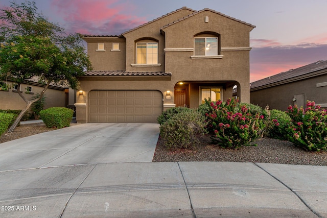 2149 E Aire Libre Ave, Phoenix, AZ 85022 - mediterranean / spanish-style house featuring a tiled roof, stucco siding, a garage, and driveway