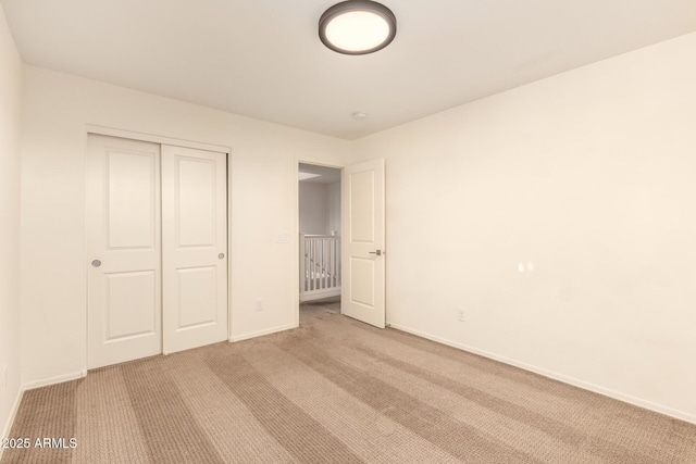 2149 E Aire Libre Ave, Phoenix, AZ 85022 - unfurnished bedroom with light colored carpet and a closet