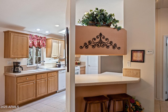 2080 W Pine Grove Dr, Show Low, AZ 85901 - kitchen with light tile patterned flooring, a kitchen bar, recessed lighting, light countertops, and white dishwasher