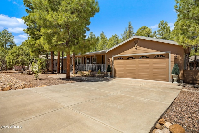 2080 W Pine Grove Dr, Show Low, AZ 85901 - single story home with concrete driveway, covered porch, and an attached garage