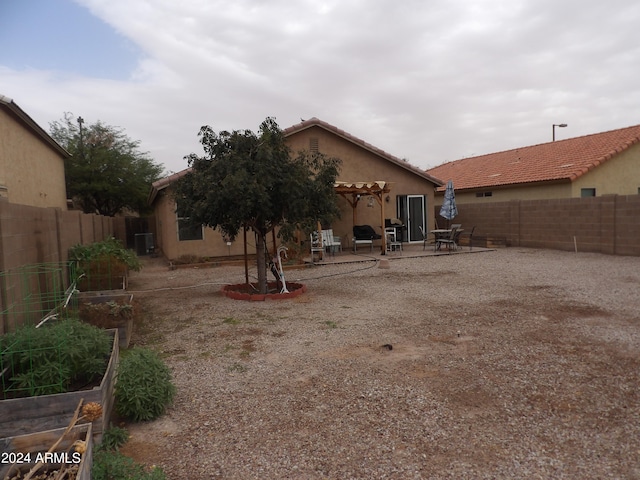 back of property featuring a patio and central AC unit