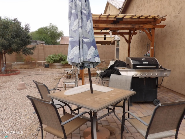 view of patio / terrace with a pergola and grilling area