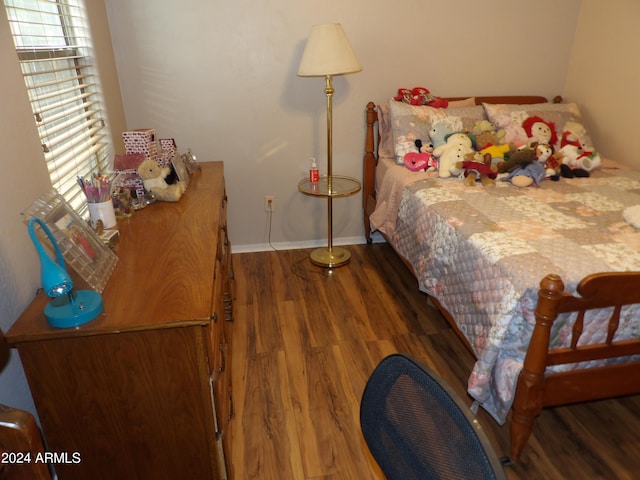 bedroom featuring dark hardwood / wood-style floors