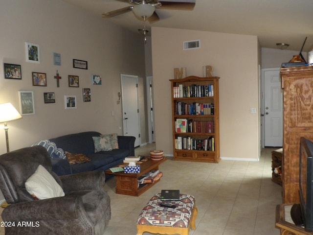 tiled living room with high vaulted ceiling and ceiling fan