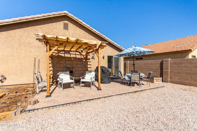 back of house with a patio and a pergola