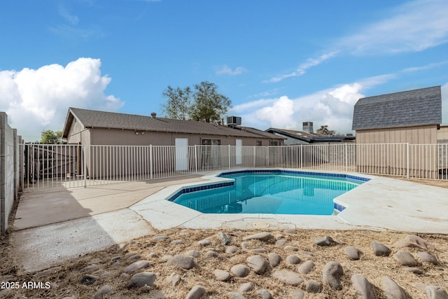 view of pool featuring a patio and central air condition unit