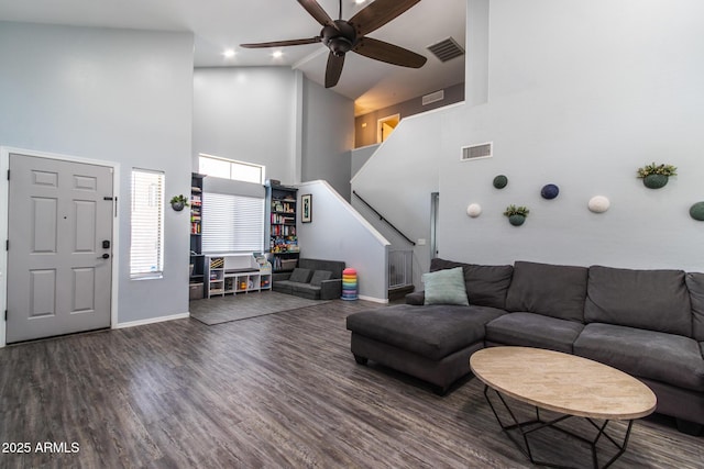 13709 W Rovey Ave, Litchfield Park, AZ 85340 - living room featuring baseboards, high vaulted ceiling, ceiling fan, stairway, and wood finished floors