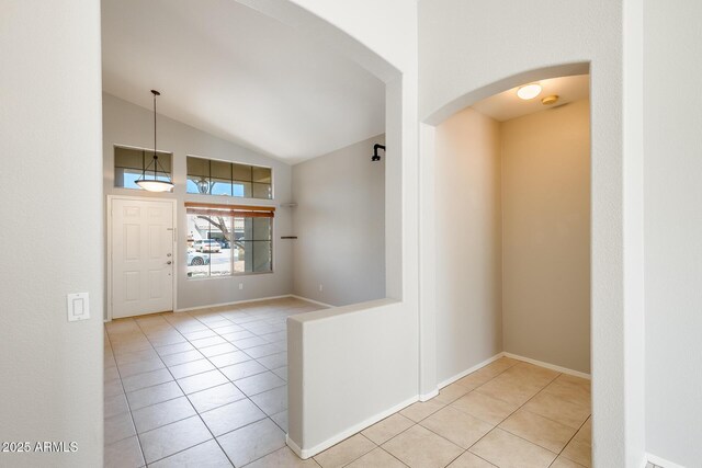 1037 E Baylor Ln, Gilbert, AZ 85296 - tiled spare room with arched walkways and vaulted ceiling