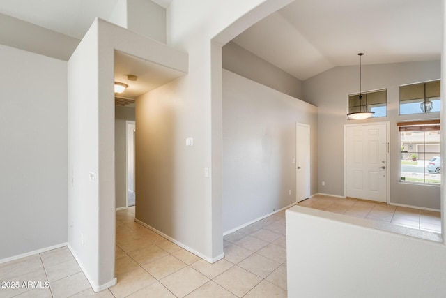 1037 E Baylor Ln, Gilbert, AZ 85296 - foyer featuring light tile patterned floors, high vaulted ceiling, and arched walkways