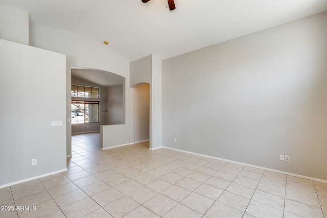 1037 E Baylor Ln, Gilbert, AZ 85296 - empty room featuring arched walkways, vaulted ceiling, ceiling fan, and light tile patterned flooring
