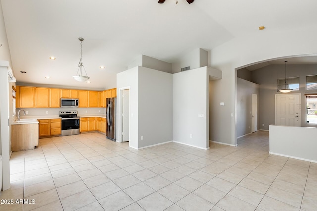 1037 E Baylor Ln, Gilbert, AZ 85296 - kitchen with appliances with stainless steel finishes, arched walkways, light countertops, open floor plan, and light tile patterned flooring