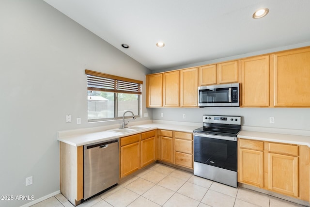 1037 E Baylor Ln, Gilbert, AZ 85296 - kitchen with stainless steel appliances, light brown cabinets, light tile patterned flooring, light countertops, and vaulted ceiling
