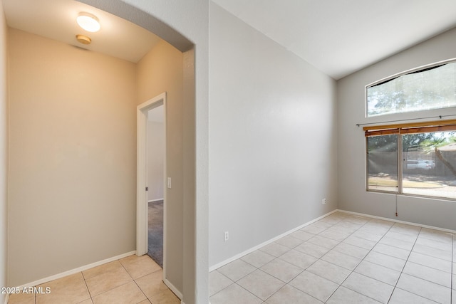 1037 E Baylor Ln, Gilbert, AZ 85296 - spare room with arched walkways and light tile patterned floors