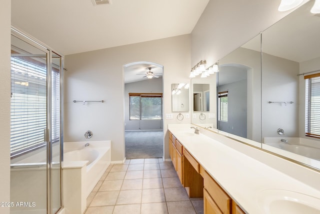 1037 E Baylor Ln, Gilbert, AZ 85296 - full bath featuring a garden tub, double vanity, tile patterned floors, and a ceiling fan