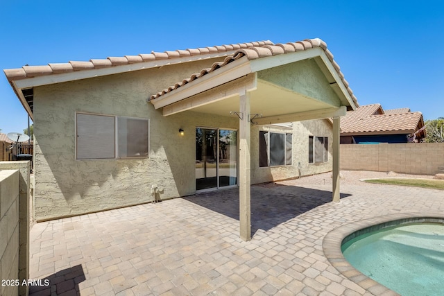 1037 E Baylor Ln, Gilbert, AZ 85296 - back of property featuring stucco siding, a fenced backyard, a patio area, and a tiled roof