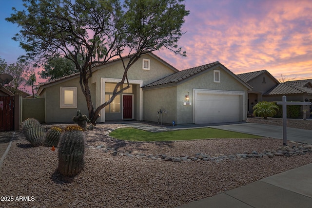 1037 E Baylor Ln, Gilbert, AZ 85296 - view of front of property with stucco siding, an attached garage, driveway, and a tiled roof