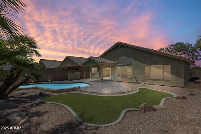 1037 E Baylor Ln, Gilbert, AZ 85296 - pool at dusk with a fenced backyard and a patio area