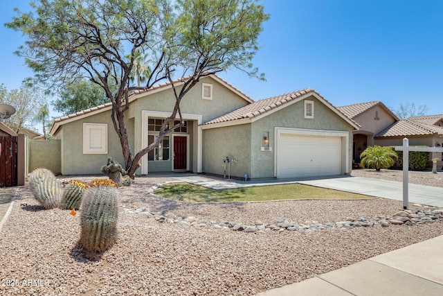 1037 E Baylor Ln, Gilbert, AZ 85296 - view of front of property featuring a garage, stucco siding, and concrete driveway