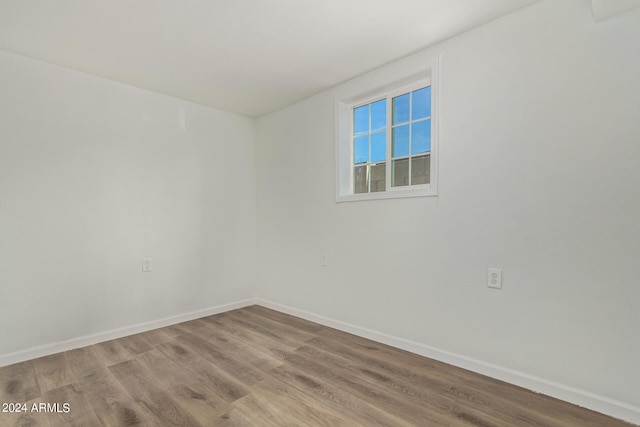 spare room with hardwood / wood-style floors