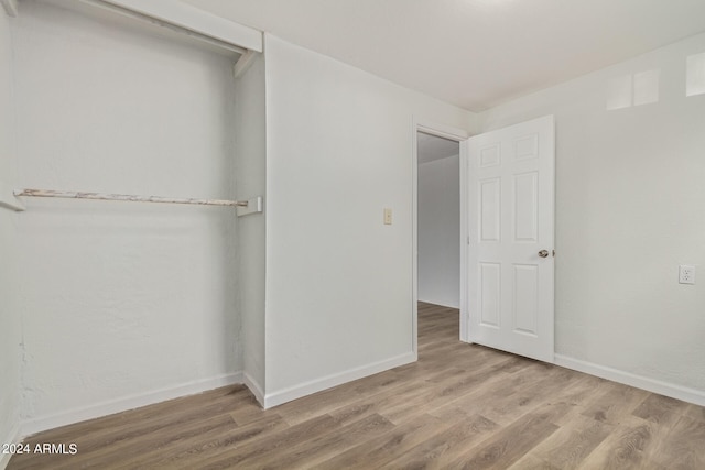 unfurnished bedroom featuring wood-type flooring