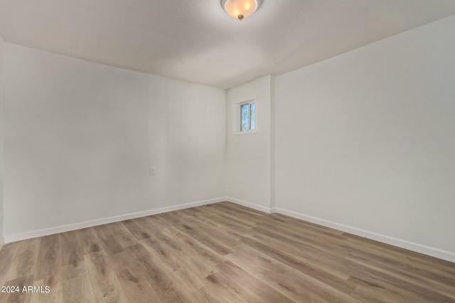 spare room featuring hardwood / wood-style flooring