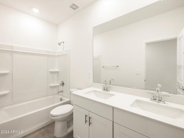 full bathroom featuring toilet, washtub / shower combination, and vanity