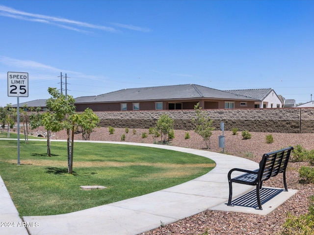 view of home's community featuring a lawn