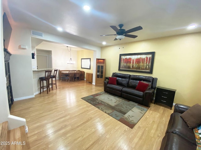 4805 E Kachina Trl Unit 25, Phoenix, AZ 85044 - living area with a ceiling fan, wood finished floors, recessed lighting, and baseboards