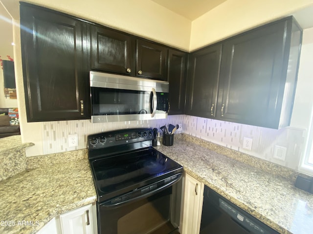4805 E Kachina Trl Unit 25, Phoenix, AZ 85044 - kitchen featuring black appliances, tasteful backsplash, and light stone countertops