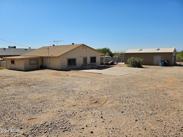 rear view of property featuring a patio area