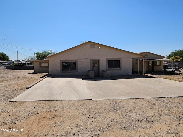 rear view of house with a patio