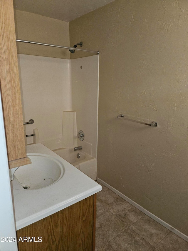 bathroom with vanity, shower / tub combination, and tile patterned flooring