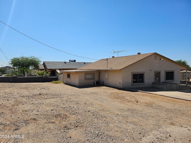 rear view of property featuring a patio