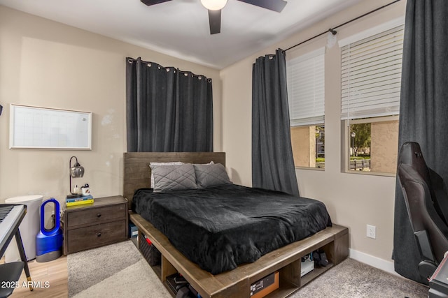 bedroom featuring a ceiling fan and baseboards