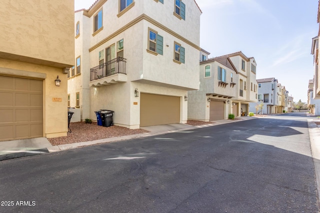 view of street featuring a residential view and curbs