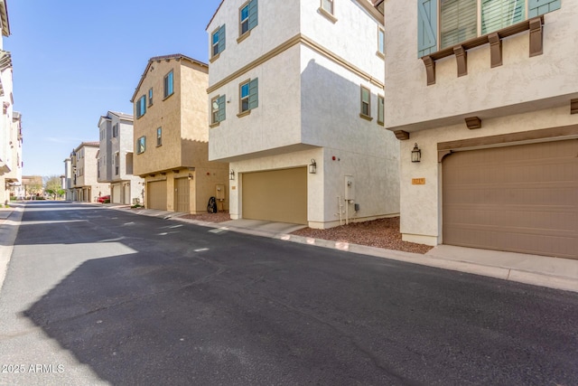 view of road featuring a residential view and curbs