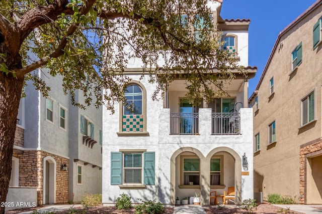 mediterranean / spanish house with stucco siding