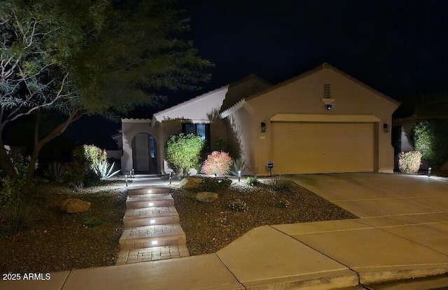 view of front of home with a garage