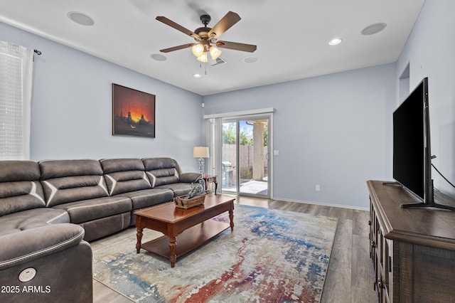 living room featuring recessed lighting, light wood-style flooring, ceiling fan, and visible vents