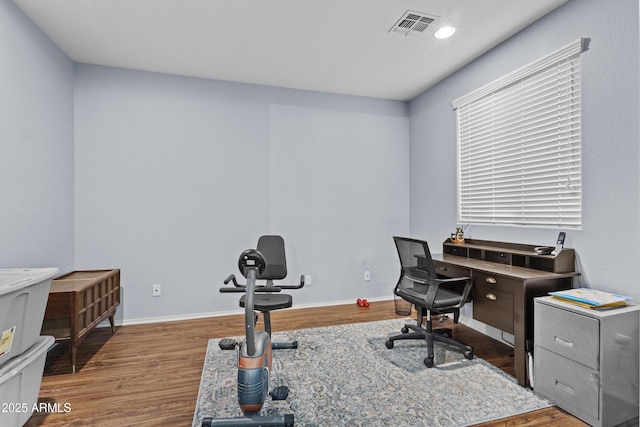 home office featuring baseboards, recessed lighting, wood finished floors, and visible vents
