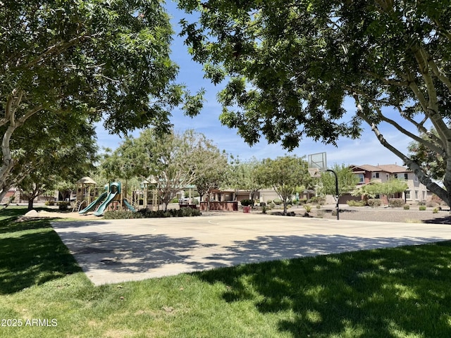view of community featuring community basketball court, a yard, and playground community
