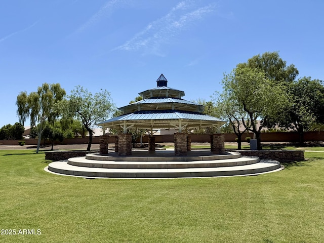 view of home's community with a lawn and a gazebo