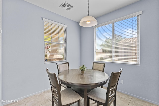 dining room with visible vents, baseboards, and light tile patterned flooring