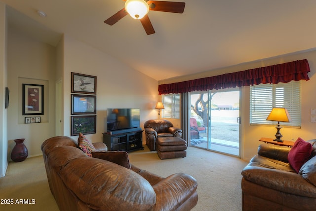 carpeted living room featuring ceiling fan and vaulted ceiling